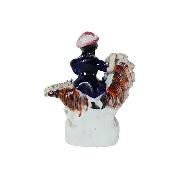 Antique English Staffordshire girl on goat. As with most early Staffordshire, there is no maker's mark. Made circa 1850....