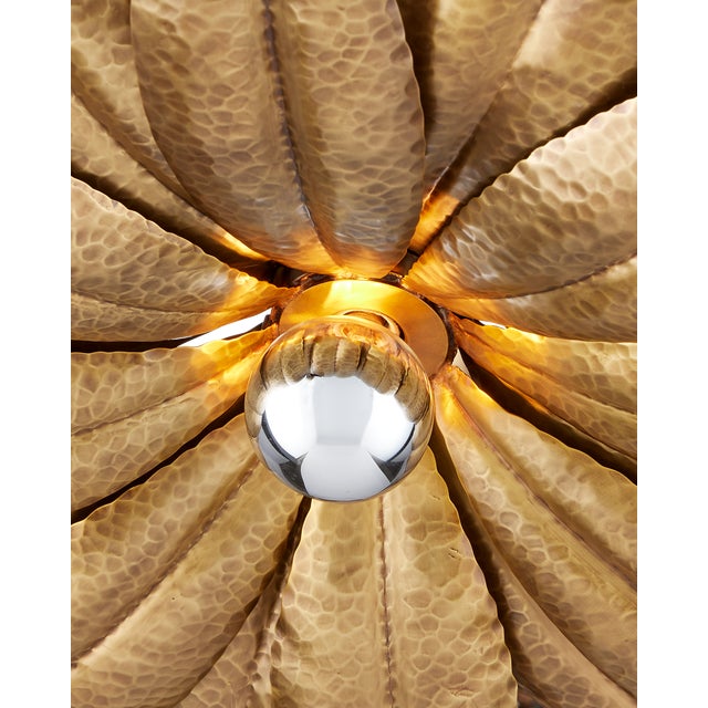The Alithea Medium Semi-Flush Mount is made of brass in an antique brass finish. The petals on this nature-inspired gold...