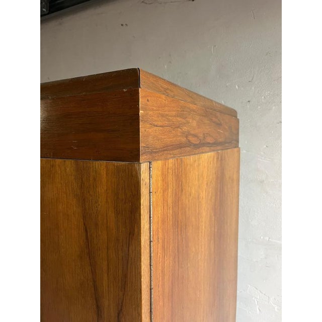 Introduction beautiful art deco three-door wardrobe featuring a central bevelled mirror and original chrome handles. A...