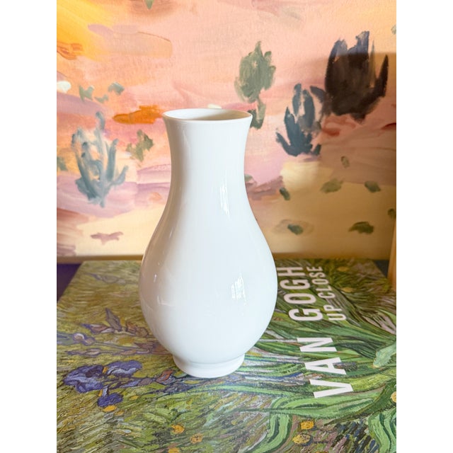 Stunningly beautiful pristine white porcelain vase in the most pleasing and timeless shape and design, by the well known...
