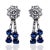 Elegant platinum earrings featuring 8 unheaded round sapphires, each weighing approximately 3.90 carats, accompanied by 18...