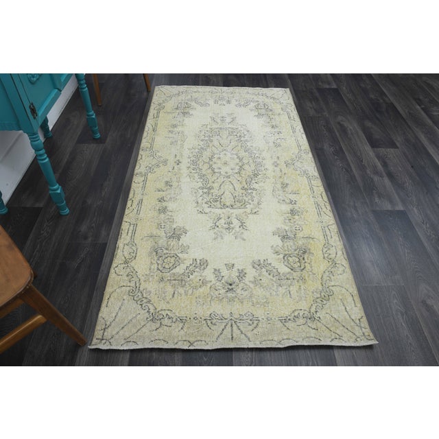 Vintage Hand-Knotted area rug is a semi-antique vintage area rug. The '70s Eastern region of Anatolia's unique rug is...