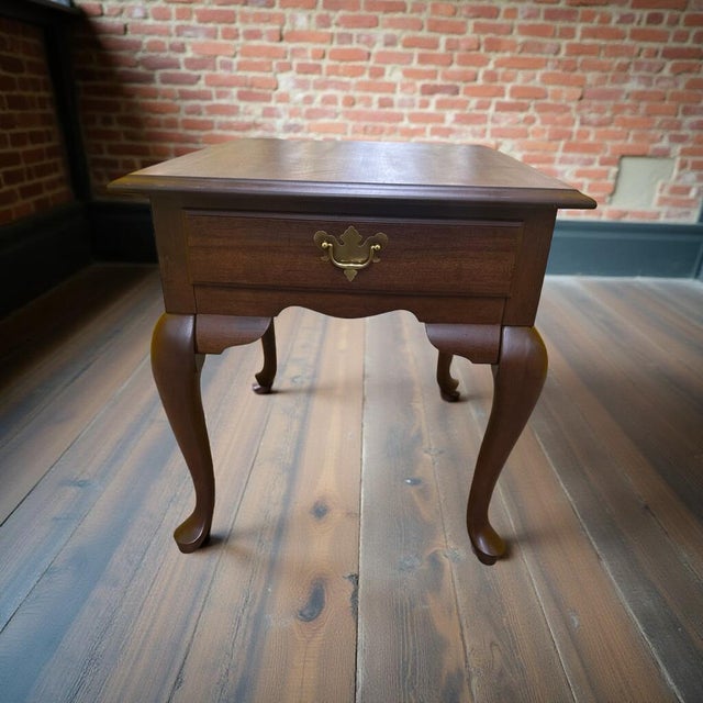 Add timeless traditional charm to your home with this Vintage Queen Anne Cherry End Table, featuring elegant cabriole...