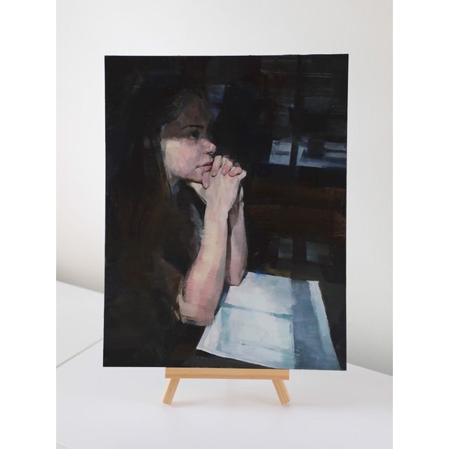 The artwork depicts a contemplative figure lost in thought, with hands clasped in front of her face, creating an intimate...