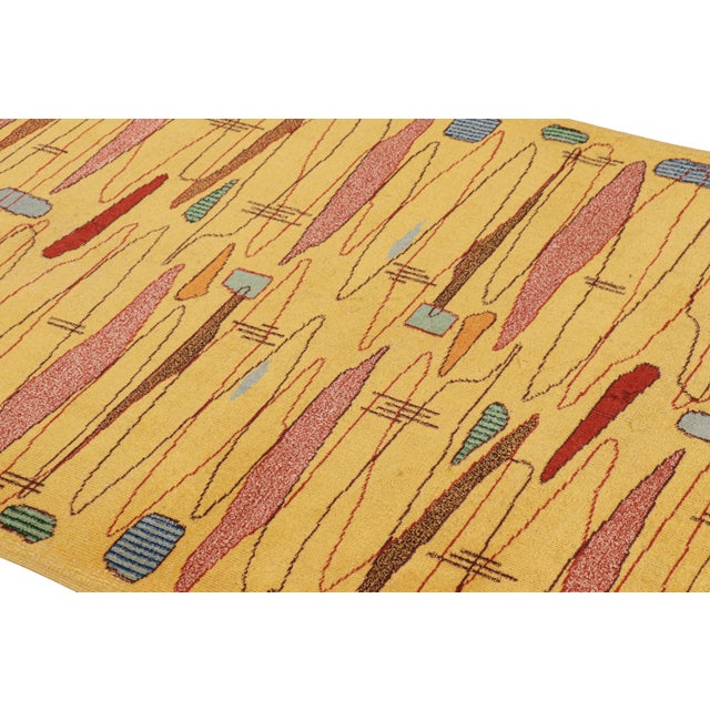 Hand-knotted in wool, this 4x7 vintage rug originating from Turkey, circa 1960-1970, is a very special piece, featuring a...