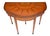 An elegant late 19th-century English Adams-style satinwood games table, attributed to the renowned London cabinetmakers...