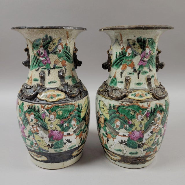 A matched mirror-image pair of Chinese Nanking crackle-glaze porcelain vases decorated in famille verte enamels with...