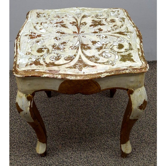 A Mid Century Franco Tacchi Italian Florentine hand-painted giltwood side table with cabriole legs. Measures 13" in width,...