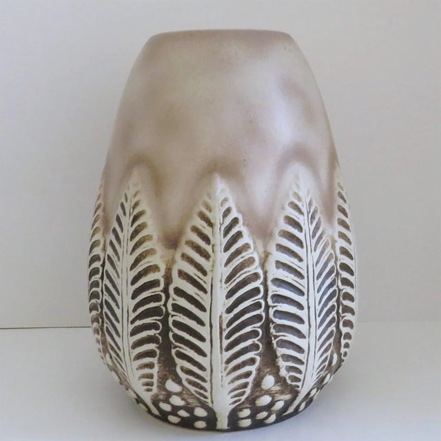 West German ceramic vase by Dumler & Breiden, in ovoid shape, finished in a soft taupe satin glaze with raised relief leaf...