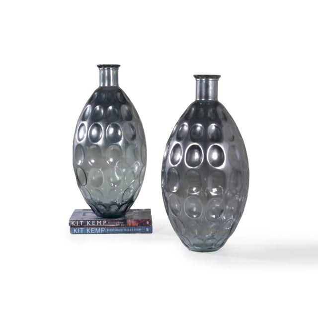 Add luster to any space with this pair of monumental pressed glass vases. These vases feature a slightly metallic finish...