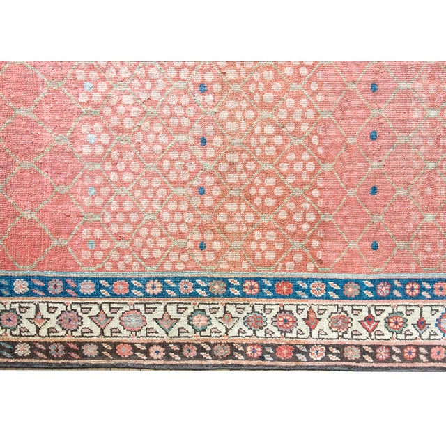 Woven circa 1900, this early 20th-century Persian Karabakh runner is a lyrical example of the regions romantic, floral...