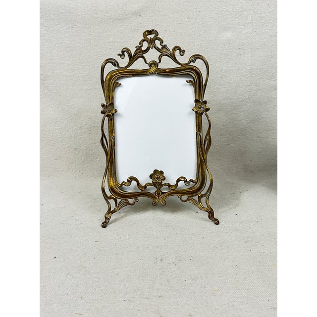 Vintage art nouveau brass picture frame decorated with flowers. This is a pre-owned item so please see all pictures and...