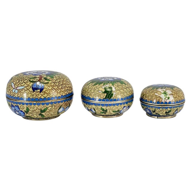 A coordinated set of three graduated Chinese cloisonné covered boxes dating to circa the 1960s–1980s, each formed in...