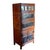 Tall Asian-style wooden cabinet featuring a warm reddish-brown finish with black lacquered panels, gold-tone decorative...