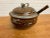 Stoneware soup tureen with lid and ladle. The ladle is a combination of stoneware with a wood stem