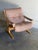 This lounge chair showcases an ergonomic inclined profile with supportive padded armrests. Vintage Scandinavian Mid-...
