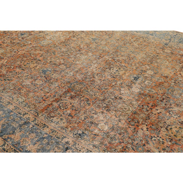 Hand knotted 10×15 antique orange-brown persian rug.