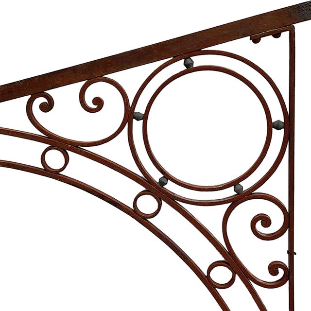 Antique Beaux-Arts style decorative cast and wrought iron canopy bracket, often used for supporting signboards or front...