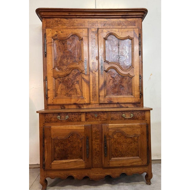 Louis XV period two-part Bressan buffet in walnut and elm Front features four doors and three drawers Scalloped crossbar...
