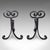 This is a pair of antique fire tool rests. An English, wrought iron fireside andiron, dating to the Art Nouveau period,...