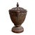 Vintage old world style cast iron lidded urn featuring a beautifully fluted body with garland motifs, decorative mask...
