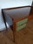 Elegant Italian design desk from the 1960s. The piece of furniture is in very good condition except for a small stain on...