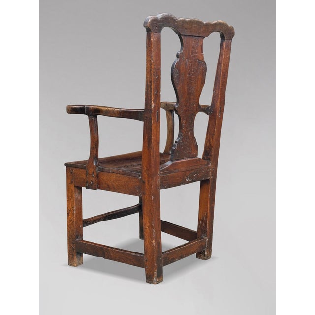 A Handsome 18th-century Georgian Oak Country Carver Armchair, circa 1760 This handsome country chair is crafted from solid...