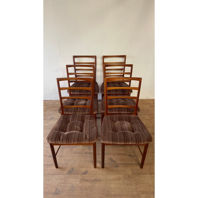 This refined set of six teak dining chairs was produced by a.h. Mcintosh of kirkcaldy, one of scotland’s most respected...