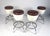 This stunning set of four vintage modern bar stools feature a backless seat and a chrome base with a footrest. The two-...