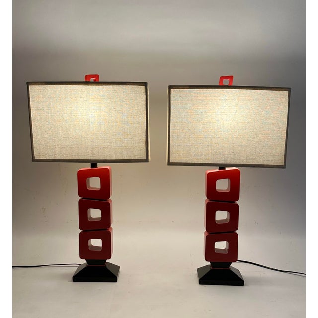 Pair of vintage Modernist Style red and black acrylic table lamps. Approximate dimensions; 22”h from base to socket, x...