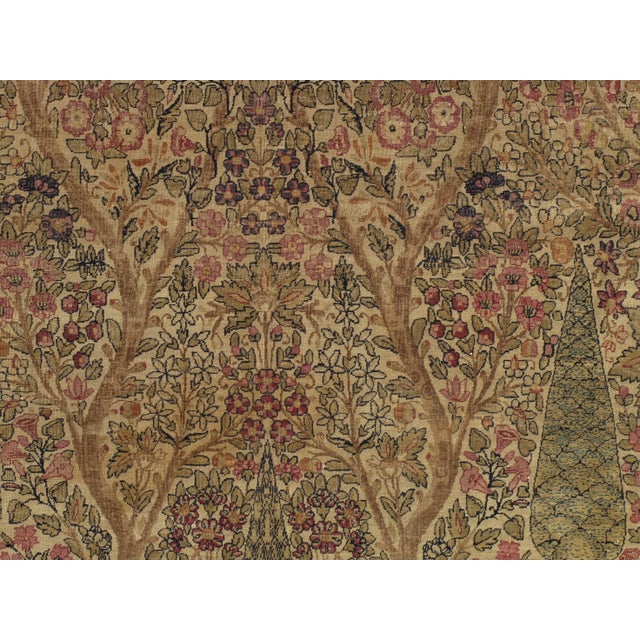 This master crafted Persian Laver Kirman carpet exemplifies the profound understanding of the artistic principles of...