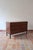 Teak chest of three drawers in the Scandinavian line of the 1960s. The drawer fronts are completely plain, with the pull...
