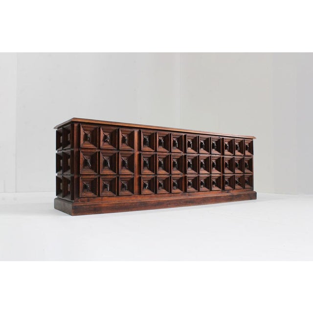 Vintage Spanish Brutalist sideboard made of carved wood from the 1960s. Beautifully designed with graphic squares and...