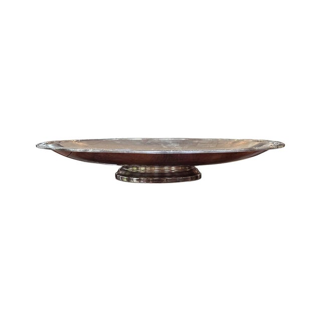 This silver-plated tray has a short pedestal (see photo). It features engraved lyre filigree detailing throughout, as well...