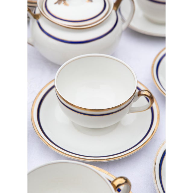 The set consists of the following 23 pieces: 6 cups: 9.5 cm diameter, 6 cm high 7 saucers: 15 cm diameter 8 dessert...