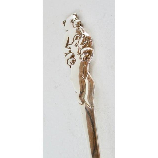 Tiffany & Co. Teddy Bear pattern sterling silver children's spoon. Teddys piggyback on the way to the table. Children's...