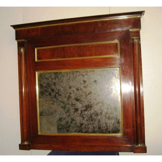 Antique Empire mantelpiece mirror. First half of the 19th century. Origin: Italy. Half-column model with bronze capitals....