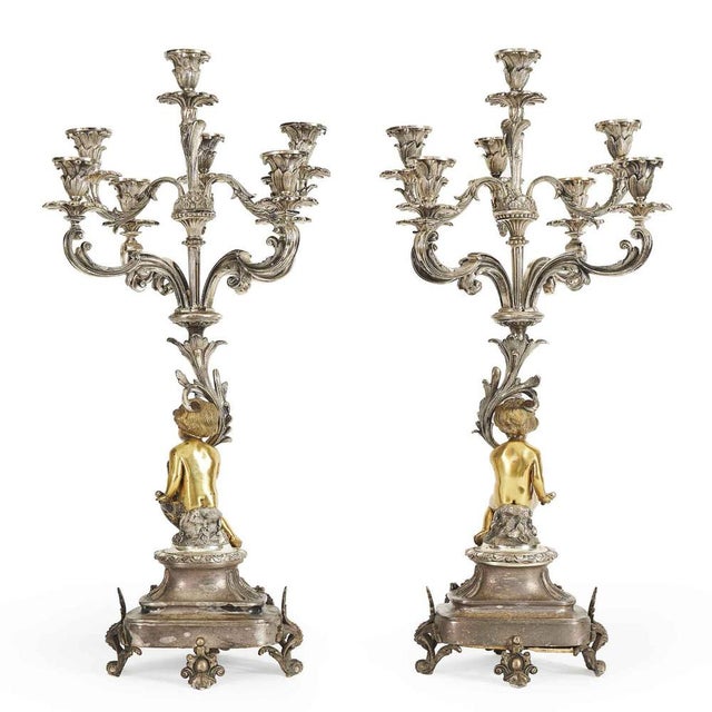 A pair of eight-branched silvered and gilded bronze table candelabras from the second half of the 19th century, crafted...