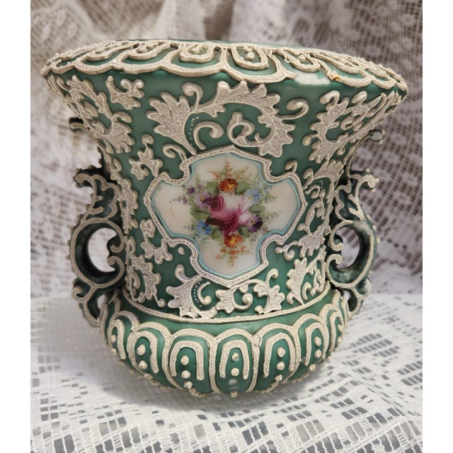 This is an unmarked Nippon Vase produced in Japan from 1891-1921. The raised pattern is in the Moriage style and is not...