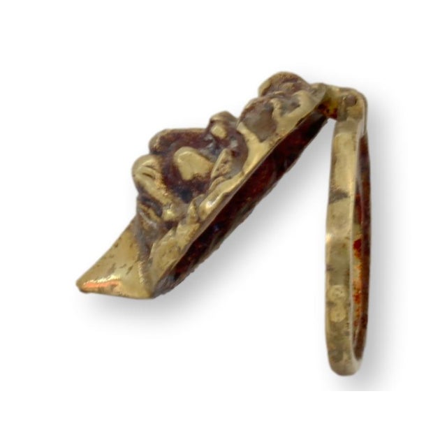 This striking vintage English door knocker features a regal lion's head design, expertly crafted in solid brass. With its...