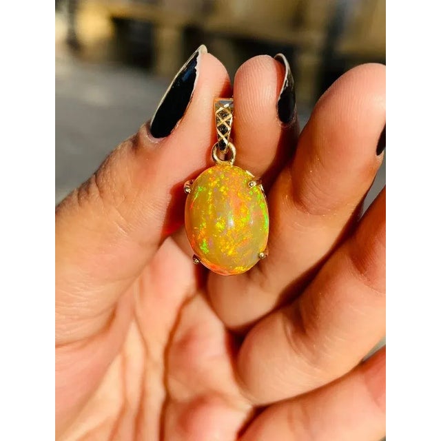 This is part of Chairish’s Fine Jewelry assortment. Opal pendant in 18K Gold. It has a oval cut gemstone that completes...