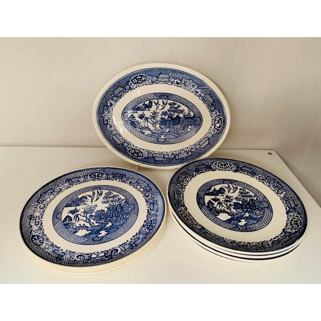 Early 20th century Blue Willow transferware consisting of dinner plates, luncheon/salad plates and an oval serving...