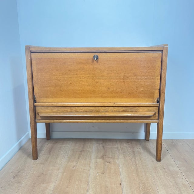 Small vintage sideboard, 1960 1 storage space with a drop-down door and 1 drawer Dimensions: 89.5 x 37 cm Height: 80 cm...