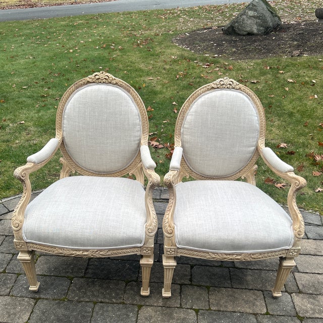 Pair Louis XV Style Upholstered Fauteuils uniquely carved round back