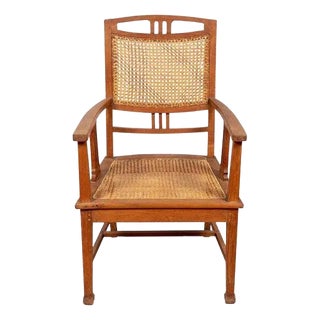 Dutch Colonial Javanese Teak Armchair with Rattan and Triglyph Inspired Motifs For Sale