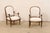 A French pair of timeless and elegant Louis XVI style armchairs from the 19th century. This antique pair of chairs from...