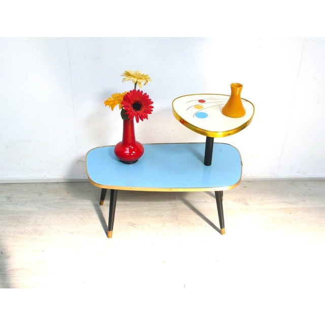 1950s/60s plant stand, side table, plant bench with two tiers, in a slanted trapezoidal shape at the bottom and a...