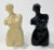 Pair of whimsical resin salt and pepper shakers highlighting the female form. One ivory and one black, salt and pepper...