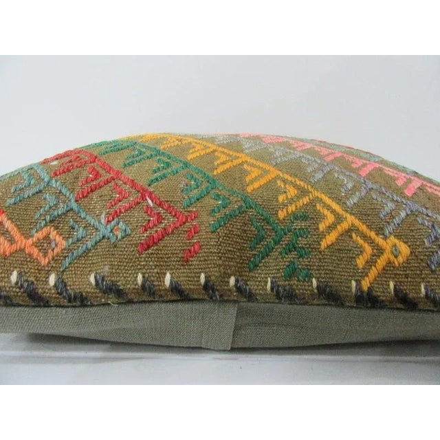 This is a pillow cover made from a vintage kilim rug. The piece was properly washed and ready to use. Pillow inserts not...