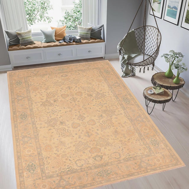 Enhance the ambiance of your home with this magnificent Persian-influenced Turkish hand-knotted rug made by skilled...